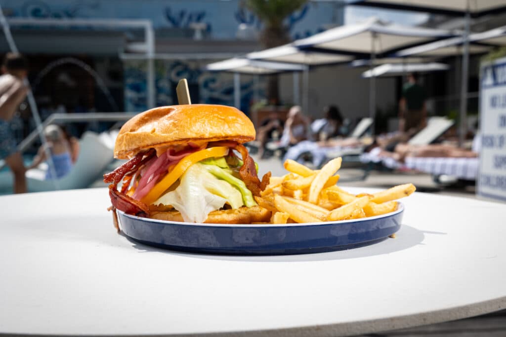 Burger by the pool at Compass Pool and Lounge at Plant Riverside District
