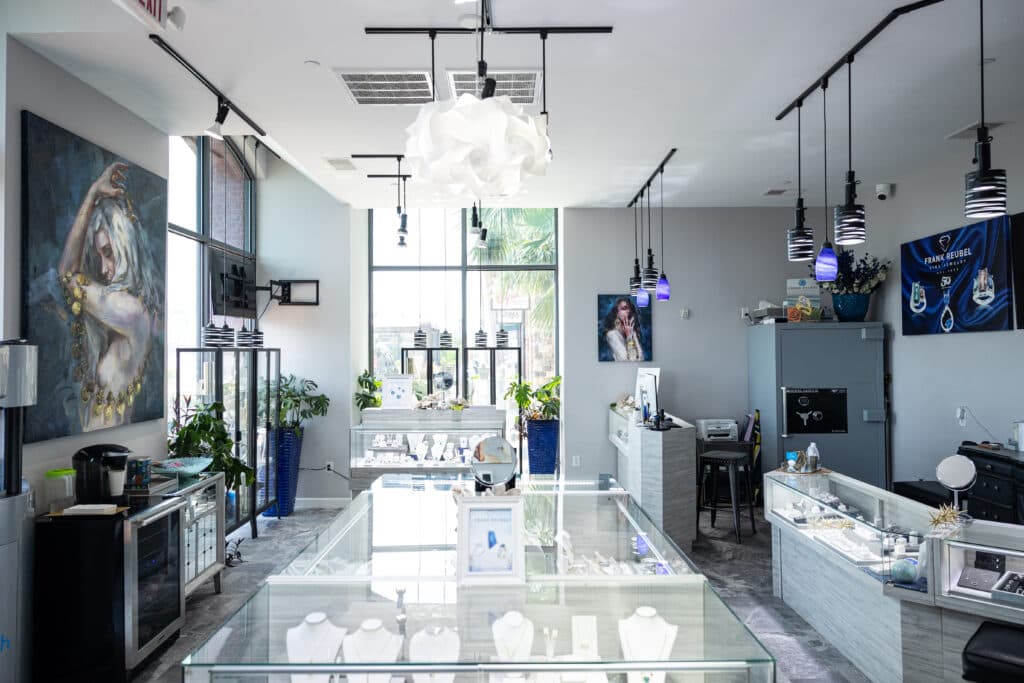 Frank Reubel inside fine jewelry rings and earrings at Plant Riverside District Savannah
